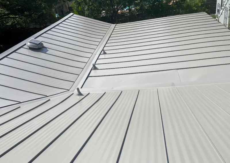 Solar attic fan installed on a metal roof for Roof Ventilation in The Pinery